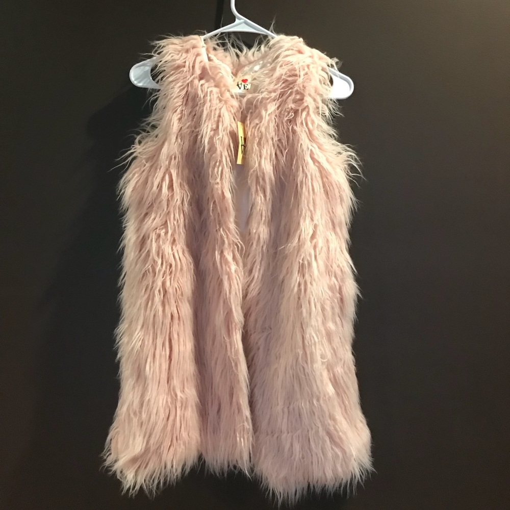 Love point fuzzy vest. Size small. NWT.